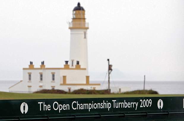 FILE - This July 2, 2009, file photo, shows the Turnberry Lighthouse on the Ailsa Course at the Turnberry golf course in Scotland. American developer Donald Trump has agreed to buy Turnberry Resort, famous for its Ailsa Course that has hosted the British Open three times. Terms of the deal were not disclosed. The Independent in London reported that Trump paid Dubai-based Leisurecorp just over $63 million (37.5 million pounds). (AP Photo/Scott Heppell, File)