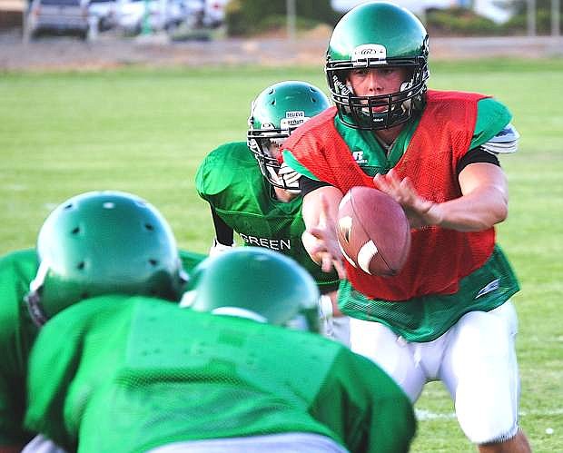 Fallon senior quarterback Morgan Dirickson takes a snap during Monday&#039;s practice at the Edward Aricinega Complex. The Greenwave hosts Fernley on Saturday at 9 a.m. in a scrimmage.