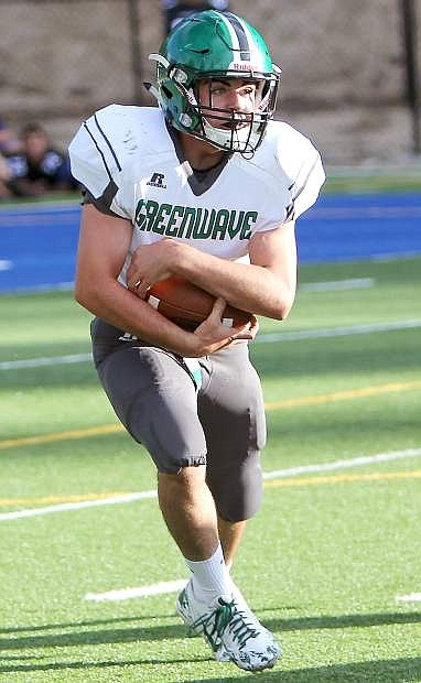 Greenwave running back Brock Uptain looks for a hole during Fallon&#039;s 34-23 loss to Tokay (Calif.) on Friday at South Tahoe High School.