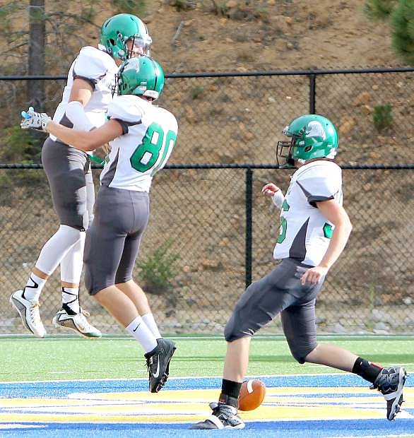 Fallon quarterback Connor Richardson, left, celebrates a touchdown against Tokay (Calif.) last week. The Greenwave hosts Truckee at 7 p.m. today.