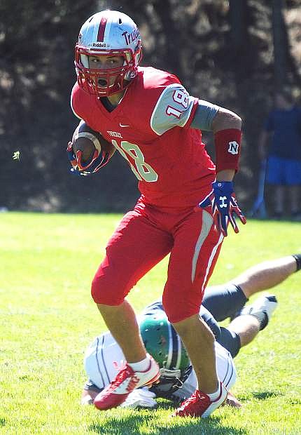 Truckee running back Tanner Sawyer slips a tackle during the Wolverines&#039; 28-6 loss to Fallon on Saturday.