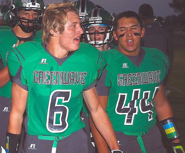 Fallon&#039;s Cameron Matzen, left, and Dylan Jabines celebrate after Matzen&#039;s 50-yard interception return for a touchdown in the first quarter of Friday&#039;s game against Dayton. The Greenwave won, 54-7.