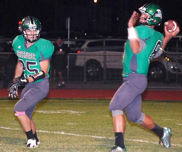 Fallon quarterback Joe Pyle delivers a pass as running back Charles Fulks helps with protection during the Wave&#039;s 62-7 pasting over Dayton on Friday at the Edward Arciniega Complex.