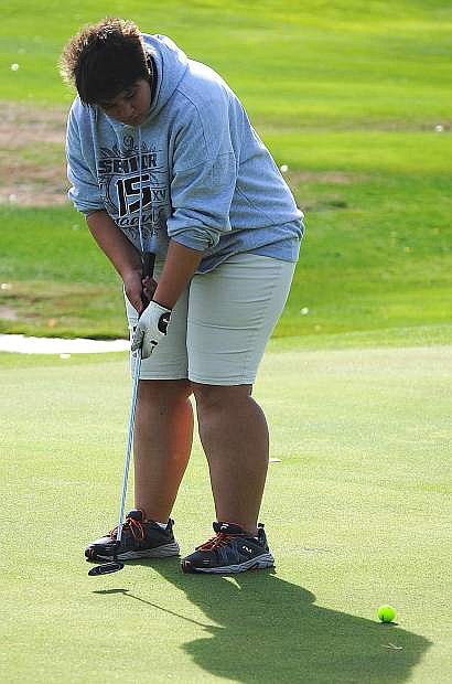 Fallon girls golfer Tabetha Park watches her putt during Wednesday&#039;s Northern Division I-A league match at the Fallon Golf Course. Park will compete at the state tournament on Monday and Tuesday in Elko.
