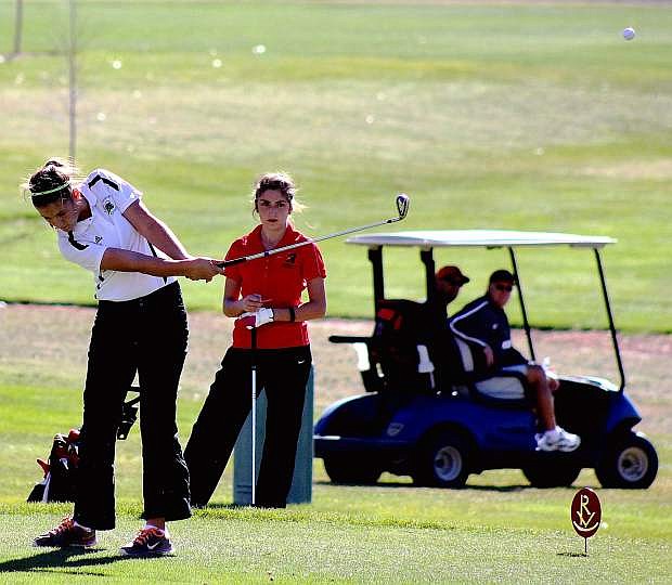 Fallon golfer Hannah Evans hits an approach shot during Tuesday&#039;s second round of the Division I-A girls state golf tournament in Elko.