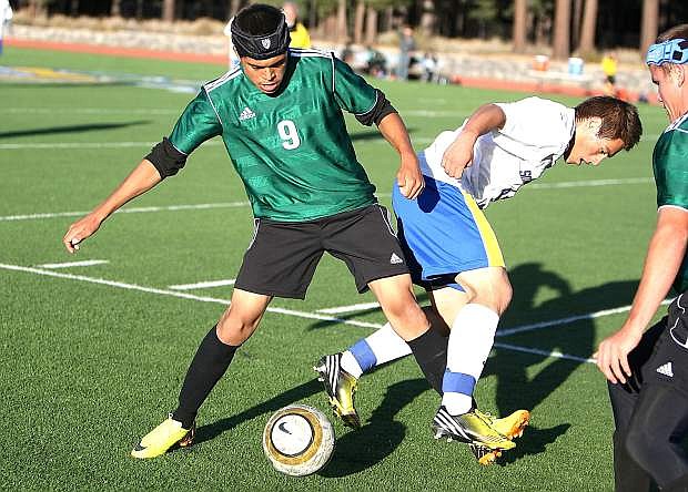Fallon&#039;s Fidel Enrqiuez, left, steals the ball from a South Tahoe player as Josh Moulton, right, looks on during the Greenwave&#039;s 3-1 loss on Thursday.