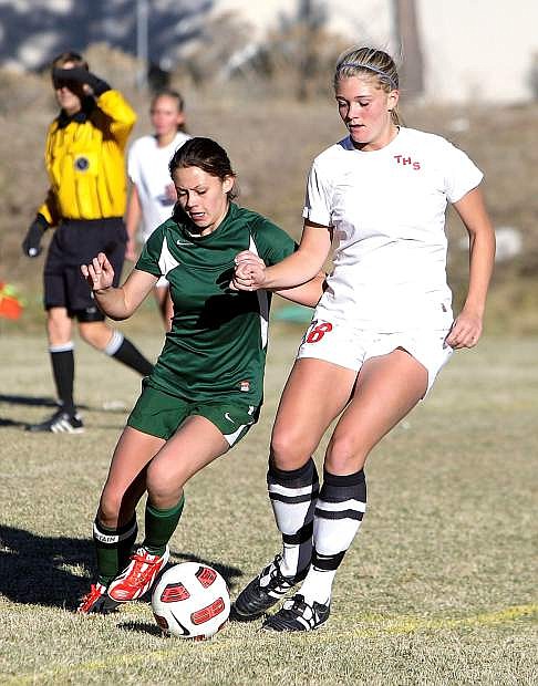 Fallon&#039;s Monica Mills, left, battles Truckee&#039;s Sarah Svoboda for the ball during the Wolverines&#039; 2-0 win on Monday in Truckee. Fallon and Truckee meet at 2 p.m. Friday at the Edward Arciniega Complex in the first round of the Northern Division I-A soccer playoffs.