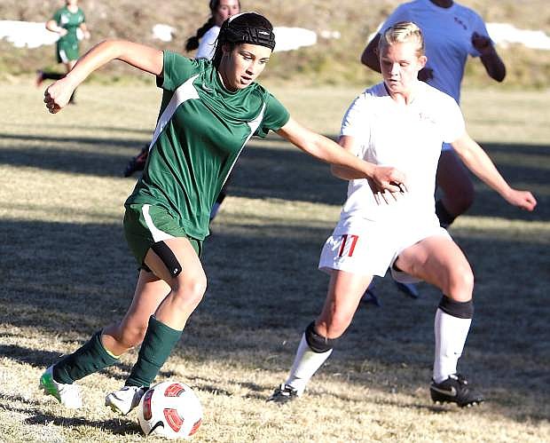 Fallon&#039;s Brittney Wallace works around a Truckee defender during Monday&#039;s 2-0 loss. The two clubs face off again today at 2 p.m. in the first round of the Northern Division I-A playoffs at the Edward Arciniega Complex.