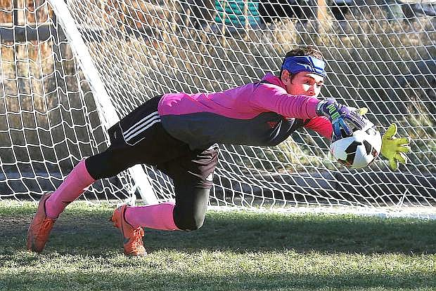 Greenwave goalkeeper Miguel Perez dives for a save during Friday&#039;s 4-1 loss to Truckee in the Northern Division I-A playoffs.