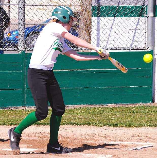 Fallon junior Rileigh Ricken follows through her swing during Saturday&#039;s first game against Silver Stage. Fallon swept the doubleheader.