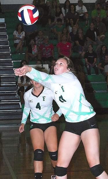 Fallon&#039;s Evan Matheson digs the ball as Zoey Swisher (4) looks on during the Lady Wave&#039;s 3-0 win over Spring Creek on Friday at the Elmo Dericco Gym.