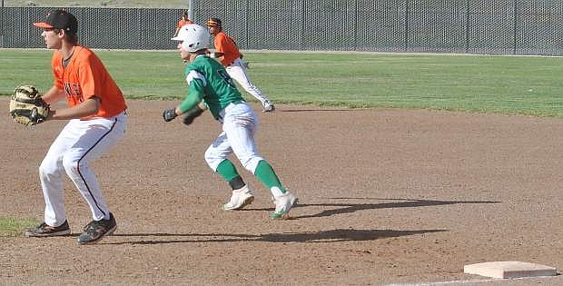 The Wave&#039;s Trae Workman takes off from Fernley first basemen Joe Ellis.