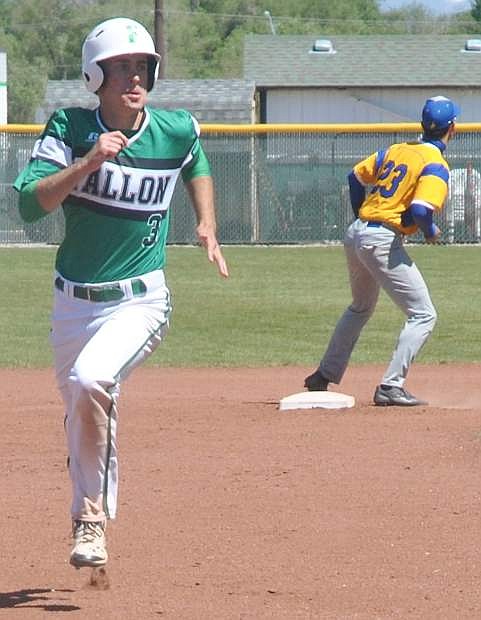 Fallon&#039;s Marshall Coverston, left, escapes a pickle at second base and runs for third.