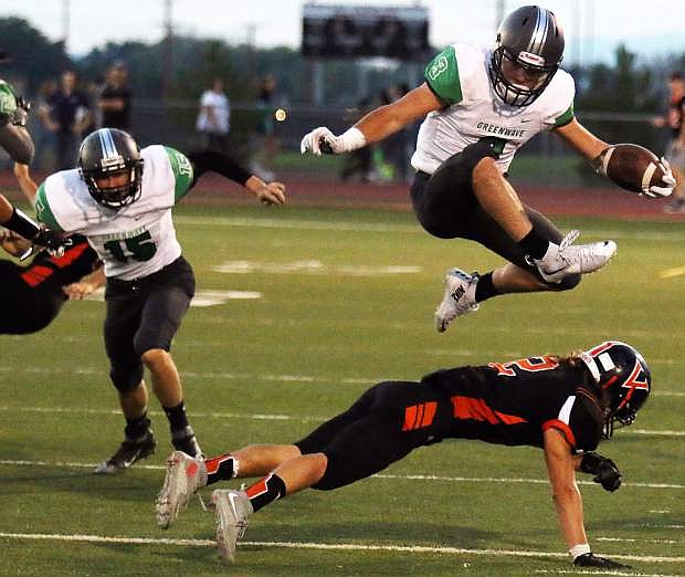 Fallon&#039;s Connor Nelson leaps over a Fernley defender in the Wave&#039;s season opener, a rivalry game against the Vaqueros.