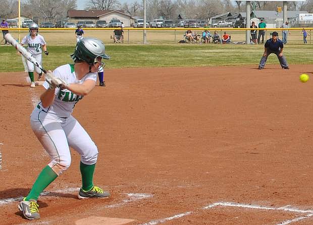 The Lady Wave&#039;s Megan McCormick cranks back at the plate while Miranda Ford is on third ready to run home.