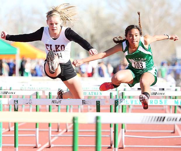Fallon&#039;s CC Ramos, right, and Elko&#039;s Marisa Richey leap neck and neck in the 100 hurdles.