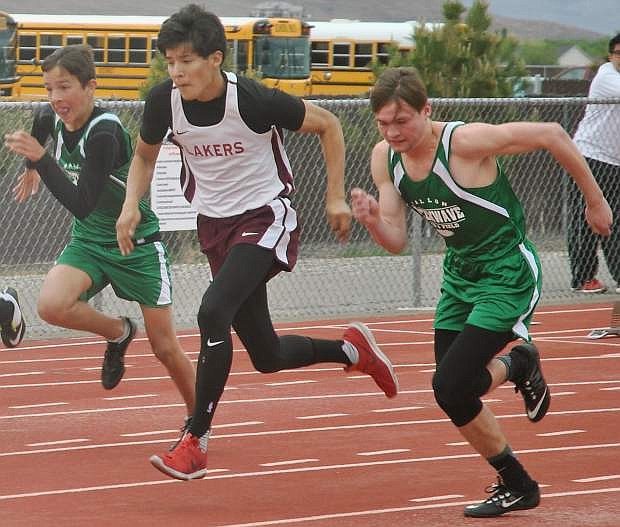 Fallon&#039;s Juan Mazuera, left, races McQueen&#039;s Najee Jackson and fellow Fallon runner Clayton Steelmon in the 100-meter dash during the abbreviated meet at Fernley.