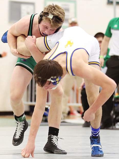 The Wave&#039;s Sean McCormick (green) grapples Lowry&#039;s Nate Nelson in the regional duals.