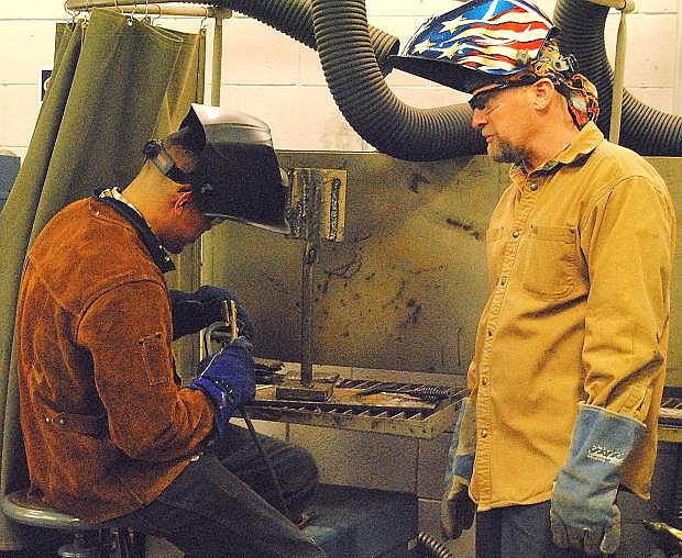 Giovanni Gonzalez, left, and Jom Lemon work on vertical welding as part of Western Nevada College&#039;s Fallon campus&#039; accelerated welding program.