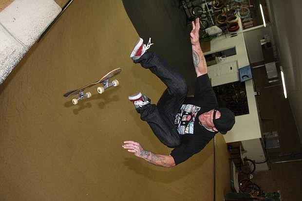 Wheelhouse employee Tim Ray rides the halfpipe in the back of the store on Saturday July 19th.