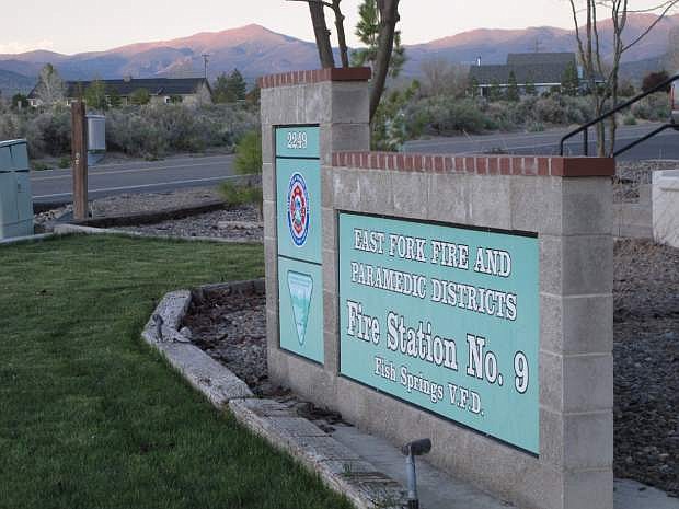 This Thursday photo shows a sign outside of Fish Springs Fire Station where dozens of people met to hear a presentation on efforts to control the population of a nearby herd of wild horses in Gardnerville. Residents of a rural northern Nevada town are volunteering in the first public-private partnership of its kind providing water for wild horses on the range and shooting the mares with contraceptive darts to help shrink the size of the herd.
