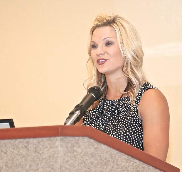 Juvenile Probation Officer Ali Banister speaks to the crowd at JPO Wilderness Program graduation Wednesday evening at the Plaza Hotel.