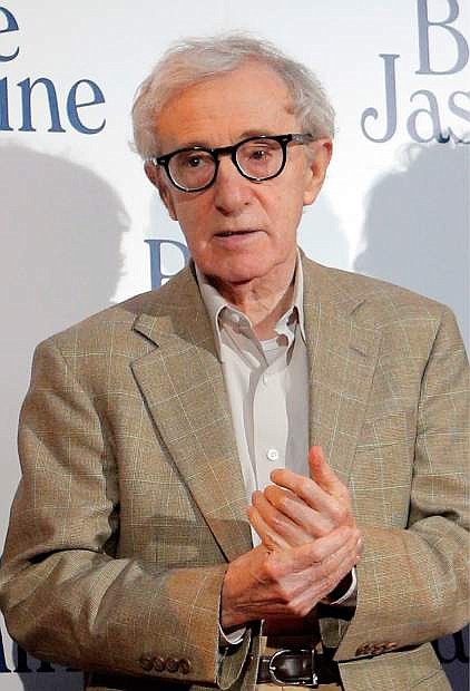 FILE - This Aug. 27, 2013 file photo shows director and actor Woody Allen at the French premiere of &quot;Blue Jasmine,&quot; in Paris. Allen is again denying he molested adoptive daughter Dylan Farrow and is calling ex-partner Mia Farrow vindictive, spiteful and malevolent in an open-letter published online Friday, Feb. 7, 2014 by The New York Times. (AP Photo/Christophe Ena, File)