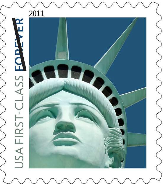 FILE - This undated file handout image provided by the U.S. Postal Service shows the Lady Liberty first class postage stamp first issued in 2011. An embarrassing Statue of Liberty forever stamp mistake is coming back to haunt the Postal Service.The design released in 2011 was not based on the statue in New York Harbor, as intended, but on a replica outside the New York-New York casino hotel in Las Vegas. Now, the sculptor who made the Lady Liberty of the Las Vegas Strip is suing the government for copyright infringement.(AP Photo/U.S. Postal Service, File)