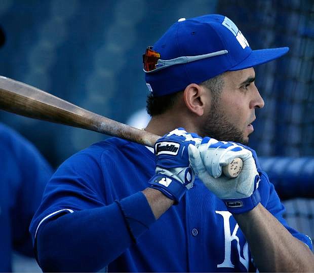 Kansas City Royals&#039; Omar Infante waits to bat during baseball practice Monday, Oct. 20, 2014, in Kansas City, Mo. The Royals will host the San Francisco Giants in Game 1 of the World Series on Oct. 21. (AP Photo/Charlie Riedel)