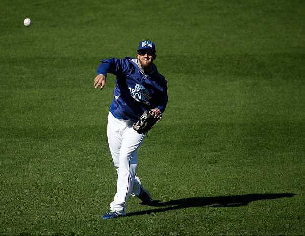 Kansas City Royals starting pitcher James Shields throws during baseball practice Monday, Oct. 20, 2014, in Kansas City, Mo. The Royals will host the San Francisco Giants in Game 1 of the World Series on Oct. 21. (AP Photo/Charlie Riedel)