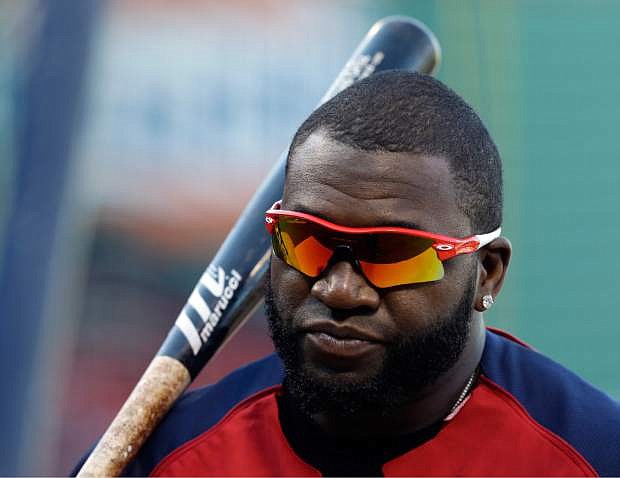 Boston Red Sox&#039;s David Ortiz waits to take batting practice during baseball practice Monday, Oct. 21, 2013, in Boston. The Red Sox are preparing to play the St. Louis Cardinals in Game 1 of the World Series on Wednesday. (AP Photo/Darron Cummings)