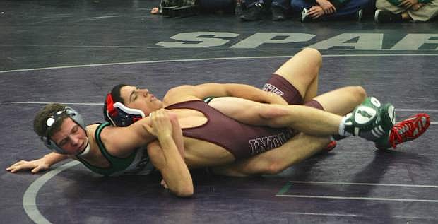 Fallon&#039;s Jordan Schultz (bottom) works for the pin during his first-round bout against Elko&#039;s Tyler Vera on Friday at Kiwanis Invitational in Spring Creek. Schultz won by pin and took the 145-pound title.