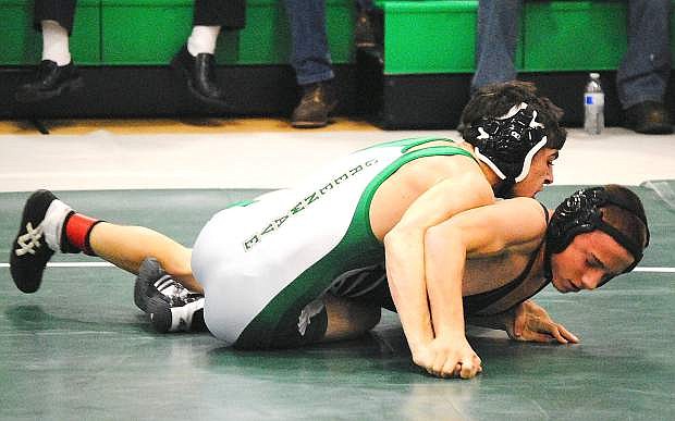 Fallon grappler Clay Amezquita works from the top position during a match this season. The Greenwave wrestle at Fernley today and Saturday.