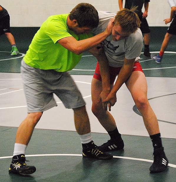 Two of Fallon&#039;s wrestling state champs from last year, Trae Workman, left, and Sam Goings, work on their technique during practice on Monday.