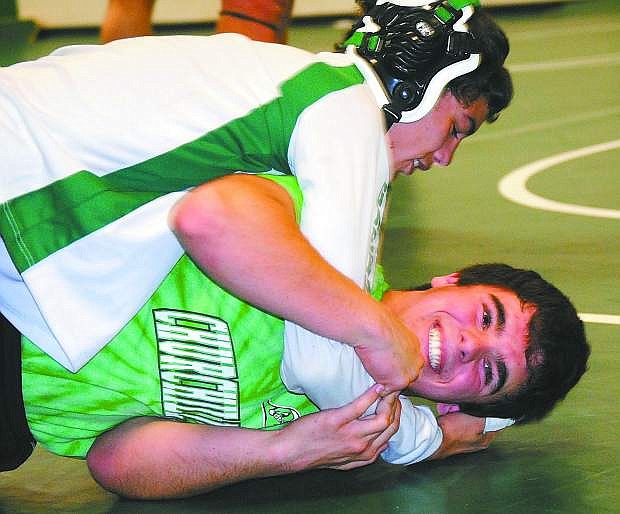 Fallon wrestlers Anthony Sabatino, top, and Louie Mori work on drills during practice. The Greenwave open the season at 5 p.m. today at Reno High School.