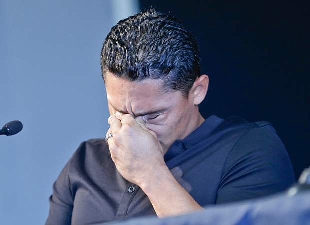 San Diego Padres shortstop Everth Cabrera, who was suspended by Major League Baseball for 50 games, breaks down while addressing the media during a news conference in San Diego, Monday, Aug. 5, 2013. (AP Photo/Lenny Ignelzi)
