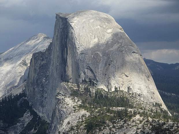 File - This August 2011 file photo shows Half Dome and Yosemite Valley from Glacier Point at Yosemite National Park, Calif. Two men, Kevin Jorgeson and Tommy Caldwell, are roughly halfway through what has been called the hardest rock climb in the world: a free climb of a half-mile section of exposed granite in California&#039;s Yosemite National Park. (AP Photo/Tracie Cone, File)