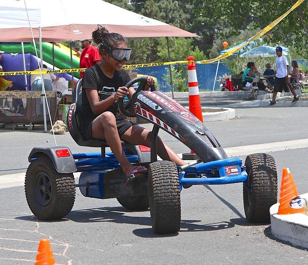 Chalina Barriga, 11, wears the &#039;drunk goggles&#039; and attemptsto navigate an obstacle course in a go-cart Saturday at Youth Awareness Day, an event hosted by the Washoe Tribe Police Department.