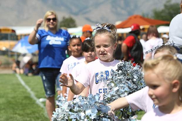 A Carson cheerleader supports her team on Saturday at the SYFL Experience.