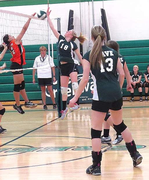 Lady Wave eighth-grader Jordan Beyer (18) makes a play on the ball during last week&#039;s match against Silverland (Fernley) as Hanna Hitchcock looks on.