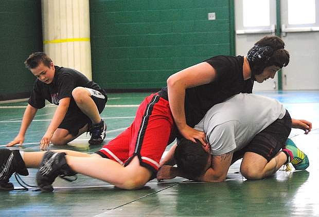 Fallon&#039;s Gabe Hardy works on his moves with assistant coach Dan Shaw during Monday&#039;s practice.