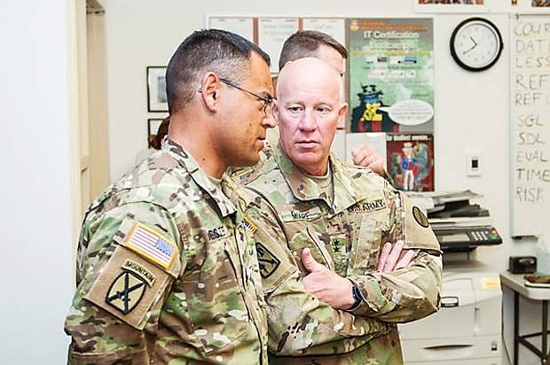 Maj. Gen. Glen Moore, the Deputy Commanding General for the U.S. Army National Guard Training and Doctrine Command, right, speaks with Master Sgt. Robert Jester, with the 421st Regional Training Institute, while observing an advanced leader course at North Las Vegas Readiness Center.