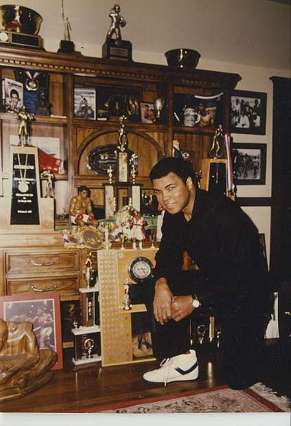 Charles Adams took this photo of Muhammad Ali in Ali&#039;s trophy room.