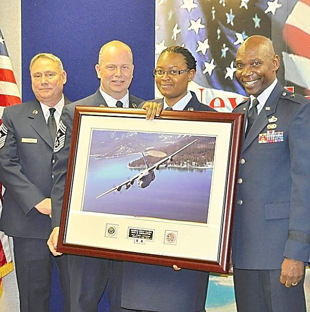 Airman 1st Class Rita Middleton, third from left, receives her Airman of the Year award at the Nevada Air National Guard base in Reno on January 25. Officials presenting the award included, from left, Command Chief Master Sgt. Rick Scurry, Command Chief Master Sgt. of the Air National Guard James Hotaling, and Brig. Gen. Ondra Berry.
