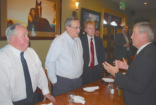 Nevada Supreme Court Judge James Hardesty, right, speaks with Assemblyman Tom Grady, Fallon Mayor Ken Tedford Jr., and assistant City Attorney Robert Erquiaga about the need for an appellate court.