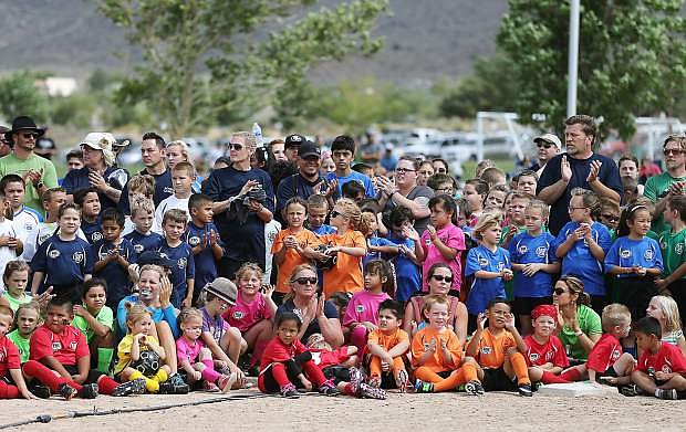 Hundreds of players, coaches and officials participate in the AYSO Fall 2015 Opening Ceremonies at Edmonds Sports Complex in Carson City, Nev., on Saturday, Aug. 28, 2015. Regional Commissioner Molly Walt says participation in the league is up 18% from last year with more than 700 players between the ages of 4-18.
