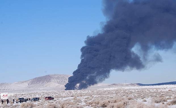 Black smoke could be seen from U.S. Highway 50 just south of Bango.