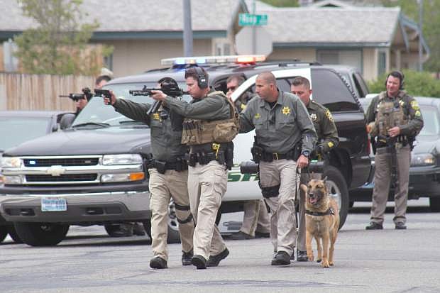 Deputies and SWAT gear up to enter the residence at the 2000 block of Hawaii Circle in Carson City Thursday. Deputies were involved in a four hour stand off with Andre Franklin, an ex-felon who was believed to be barricaded in the residence.