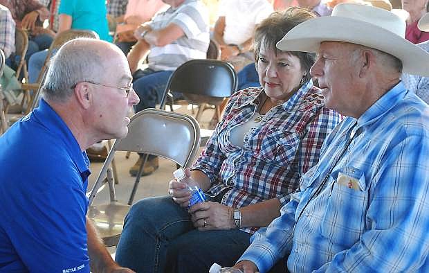 Cliven and Carol Bundy, right, chat with Churchill County commissioner Bus Scharmann  in this Lahontan Valley News file photo.