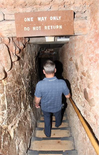 Tom Roe descends the stairs down into the mining exhibit on Thursday. He is the great-grandson of Ransom Olds, founder of the Olds Motor Vehicle Comapany and the REO Motor Car Company.